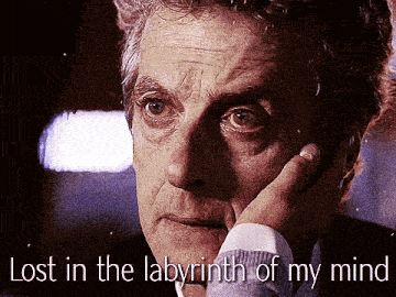 a close up of a man 's face with the words lost in the labyrinth of my mind below it
