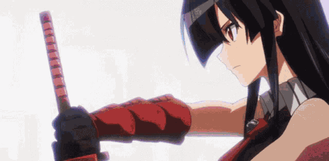 a girl with long black hair is holding a red sword in her right hand .