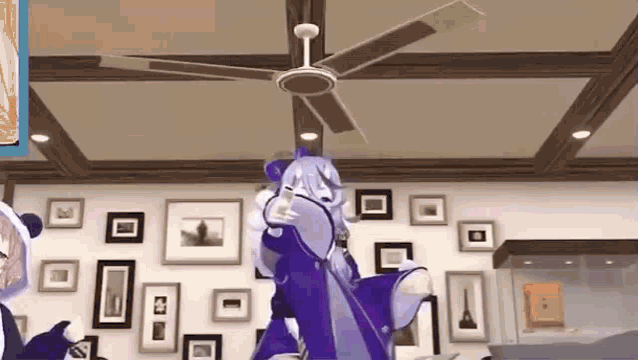 a cartoon character is standing under a ceiling fan in a room with pictures on the wall .