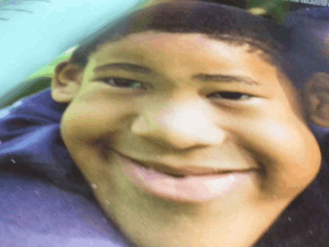 a close up of a person 's face with a big smile on it