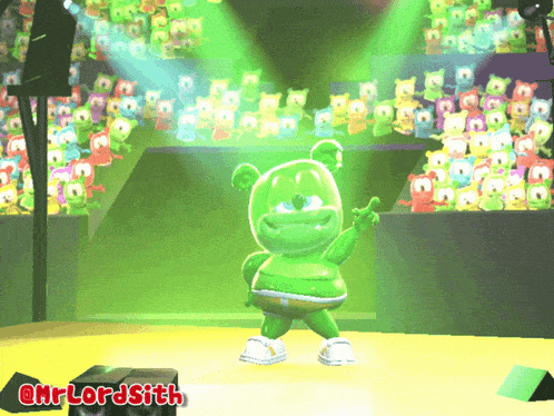 a gummy bear is dancing on a stage in front of a crowd of gummy bears and says @mrlordsith