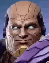 a close up of a man 's face with blue eyes and a purple helmet .