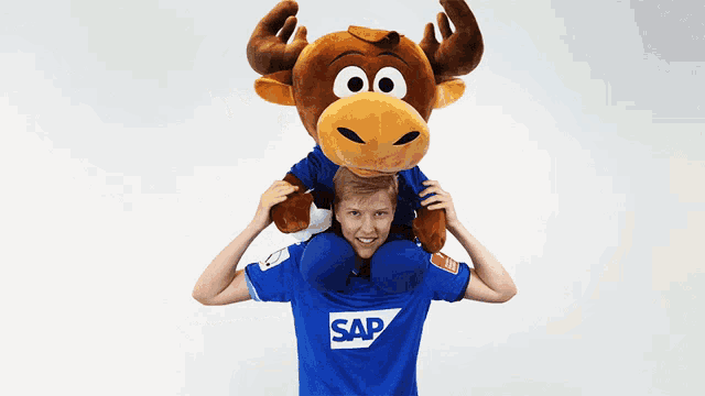 a man wearing a blue shirt with the word sap on it
