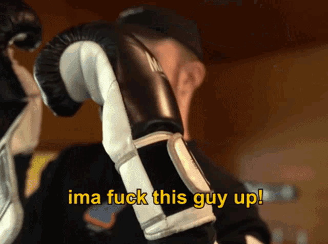 a man wearing boxing gloves has the words ima fuck this guy up above his head