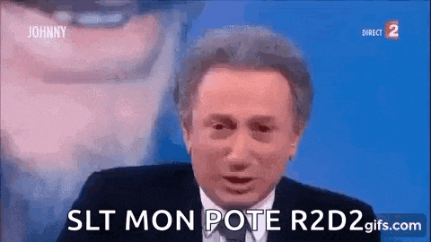 a man in a suit and tie is giving a speech on a tv screen .