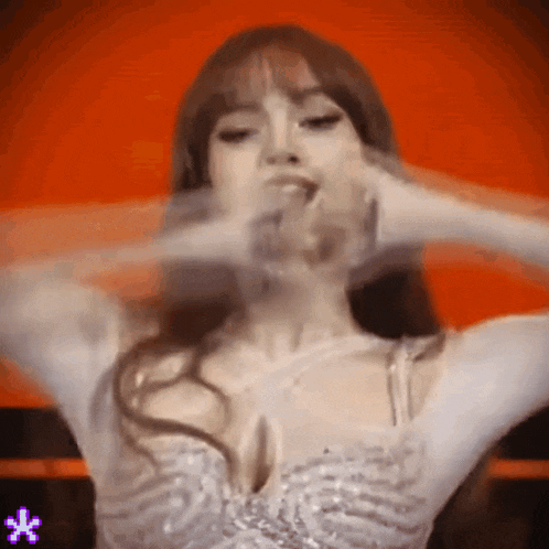 a woman in a white dress is making a funny face .