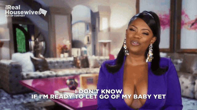 a woman in a purple top says i don 't know if i 'm ready to let go of my baby