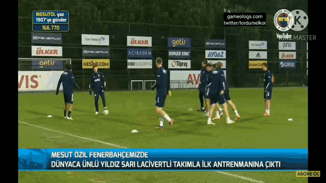 a group of soccer players are practicing on a field with advertisements for ulker and burger king