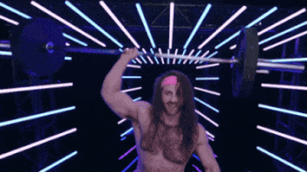 a man with long hair is lifting a barbell