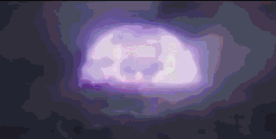 a purple glowing object in the dark with a skull on it .