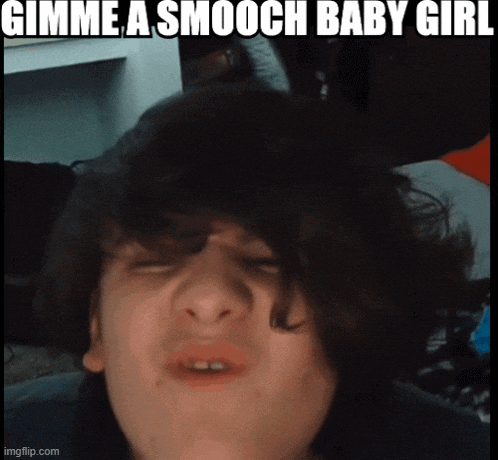 a young boy is making a funny face with the words gimme a smooch baby girl above him