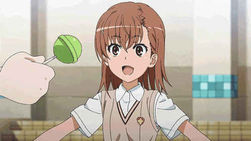 a girl in a school uniform is holding a green lollipop in her hand