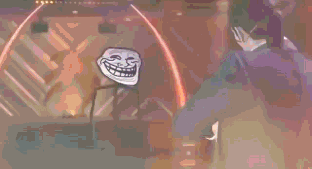 a troll face is standing on a stage in front of a red light