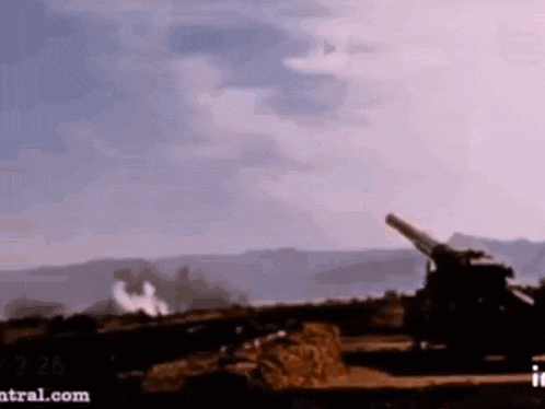 a cannon is being fired on a hill with the website central.com in the corner