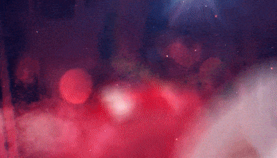 a purple and red background with a lot of smoke