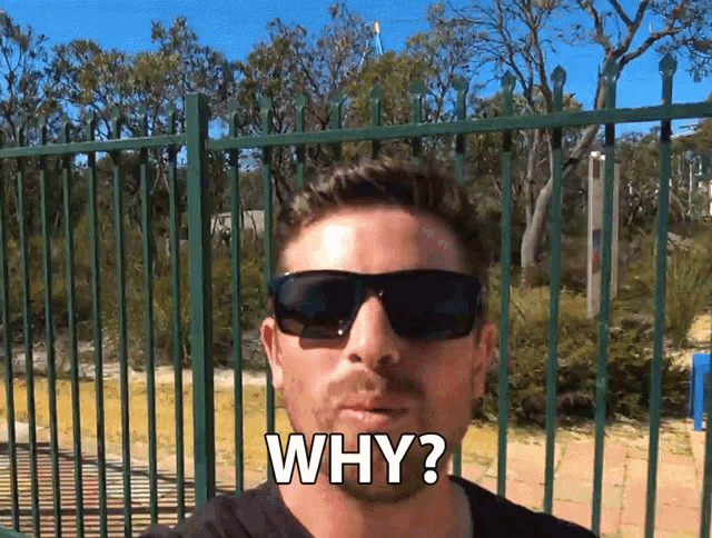 a man wearing sunglasses is asking the question " why "
