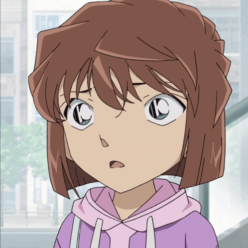 a close up of a girl 's face with the letter k on it