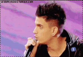 a pixelated image of a man singing into a microphone with the website jessiprincess.tumblr.com in the lower right corner