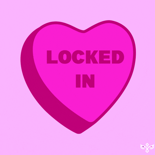 a pink heart with the word locked in on it