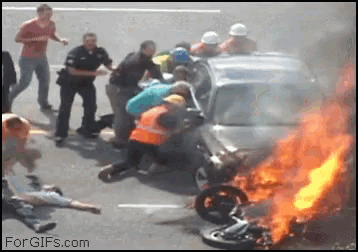 a group of people are gathered around a car that is on fire with the website forgifs.com in the corner