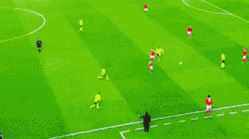 a soccer game is being played on a field that has a sign that says liga nos