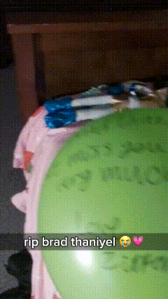 a green balloon with the words rip brad thaniyel on it