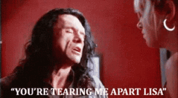 a man with long hair says " you 're tearing me apart lisa " to a woman .