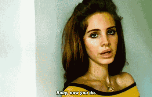 a woman in a yellow off the shoulder top is saying baby now you do
