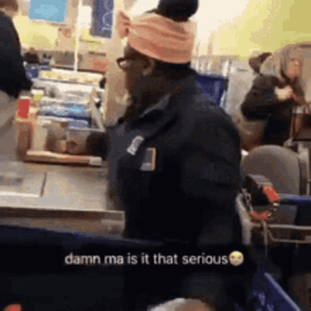 a woman is standing at a counter in a store with a caption that says `` damn ma is it that serious ''
