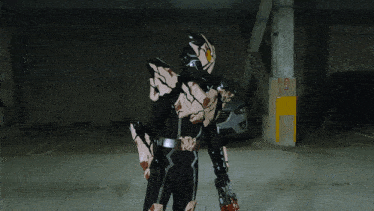 a man in a mask stands in a parking garage next to a mazda