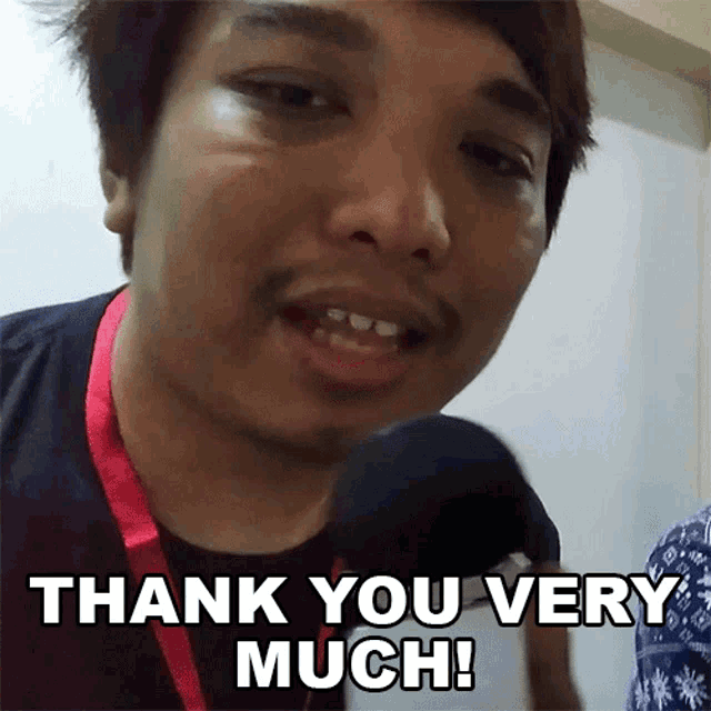 a man says thank you very much in front of his face