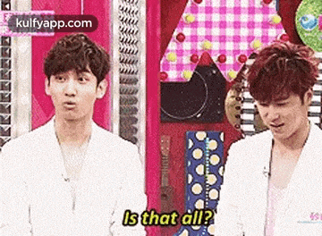 two young men are standing next to each other and one of them is asking the other , is that all ?