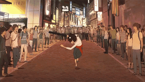 a crowd of people gathered on a street with a sign that says city on it