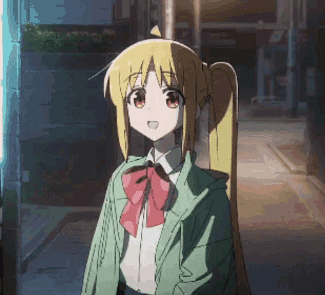 a girl with blonde hair and red eyes is wearing a green jacket and a red bow tie