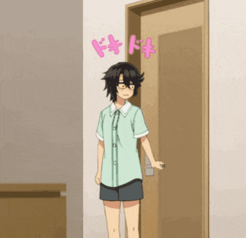 a girl with glasses is standing in front of a door with pink letters on the wall above her