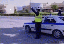 Cops High Five GIF - Cops High Five Traffic Enforcer GIFs