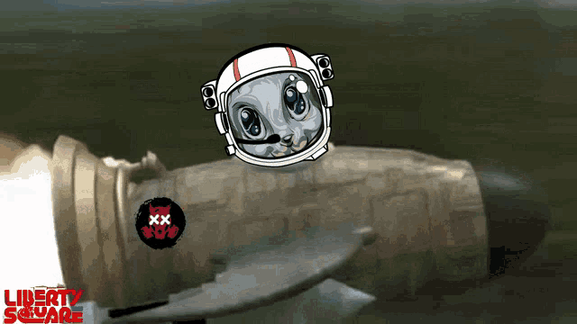 a cartoon of a cat wearing an astronaut 's helmet is flying over a rocket with the words liberty square visible