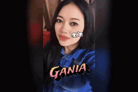 a woman with a heart on her face and the word gania on the bottom right