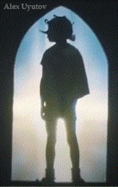 a silhouette of a person standing in front of a window with alex uyutov written on the bottom right