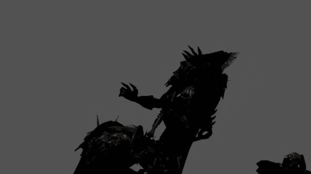 a silhouette of a man with spikes on his arms