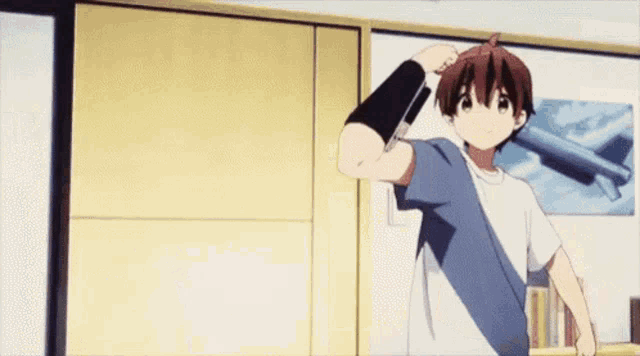 a boy is pointing a gun at another person in a room .