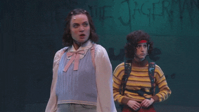 a girl with a surprised look on her face is standing next to a boy with the words and some holy ghosts below her