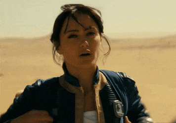 a woman in a blue jacket with the letter o on the chest