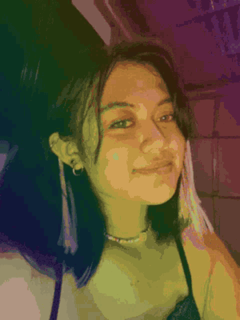 a pixelated image of a woman wearing a choker and hoop earrings