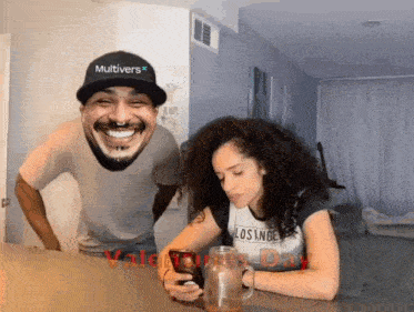 a man wearing a hat that says multivers is smiling while a woman looks at her phone