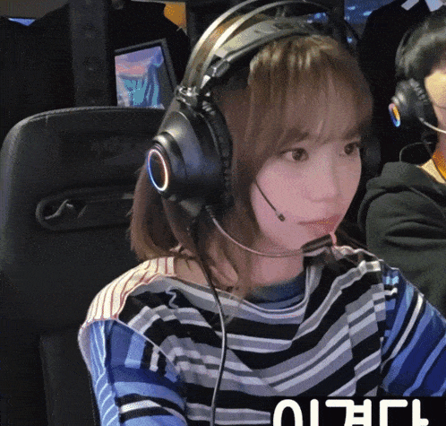 a girl wearing headphones and a shirt that says ' i 'm a ' on it