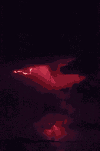 a lightning bolt strikes the ground in a dark cloudy sky
