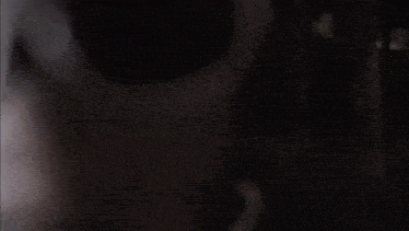 a close up of a person 's face with a skull on it
