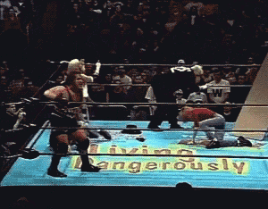 a wrestling ring with a sign that says " dangerously " on it