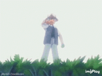 a gif of a man standing in the grass with imgplay in the lower right corner